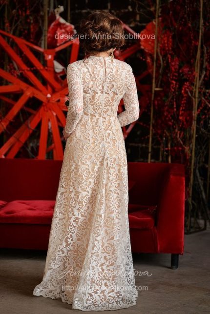 Dense lace wedding dress with long sleeves by Anna Skoblikova